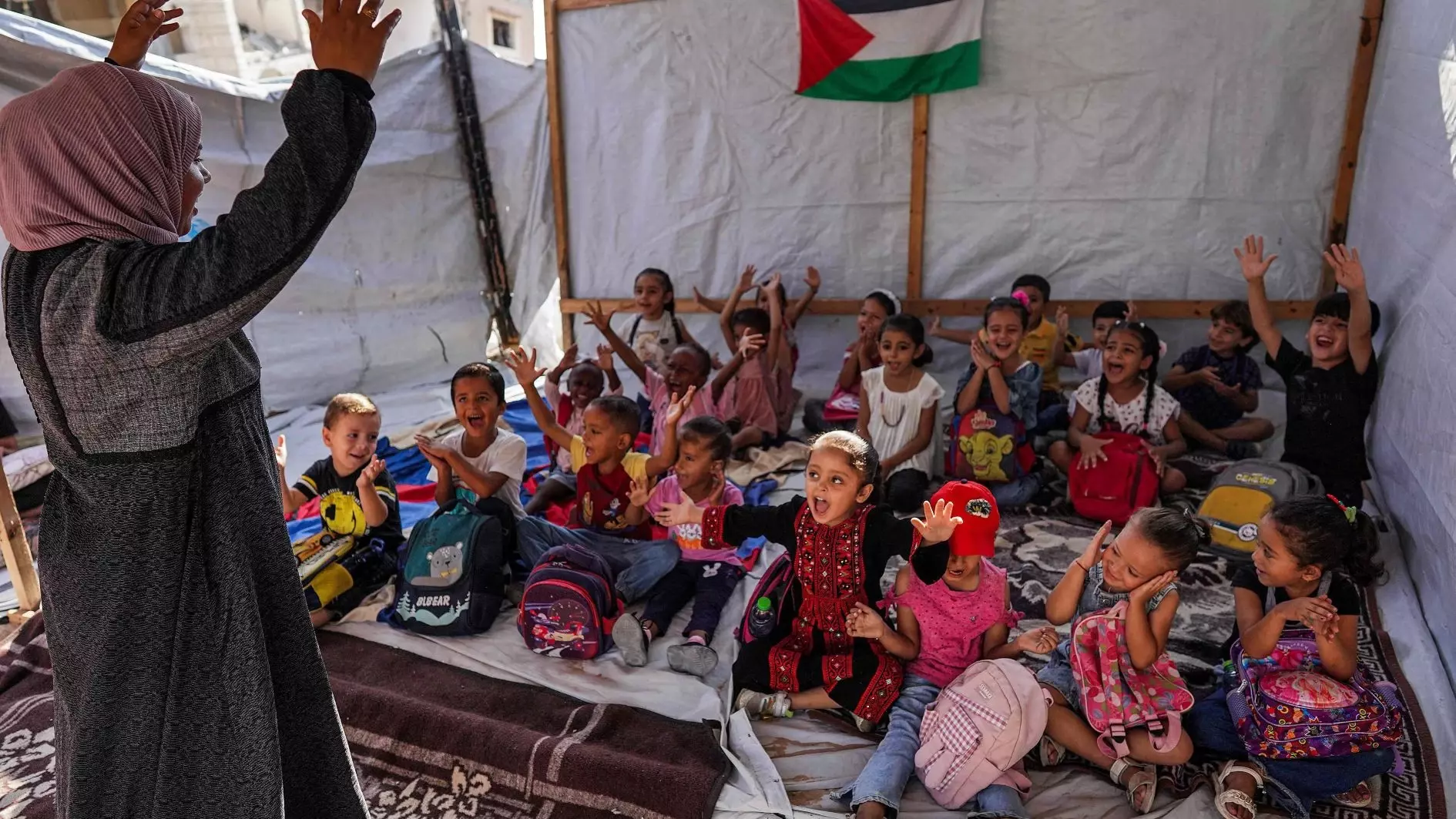 Gaza kids face sniper fire to reach makeshift tent classrooms